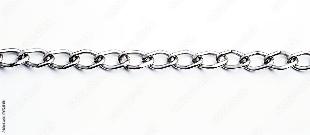 Close-up of a chain clasp on a white surface Close-up of a chain clasp on a white surface