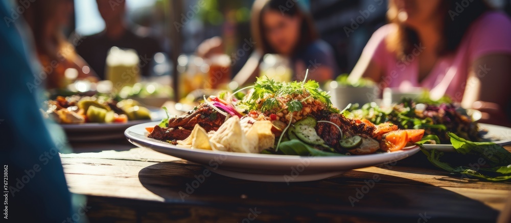 People dining with plates and drinks