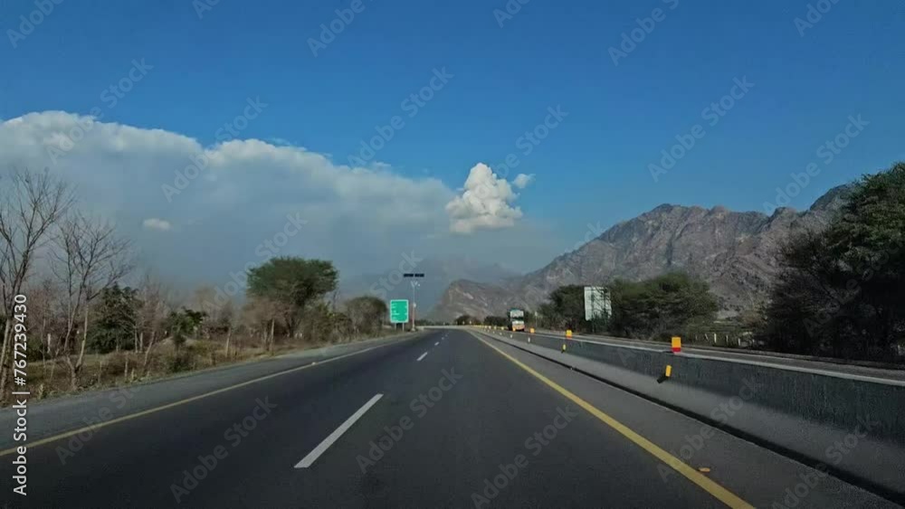 driving on the highway and clouds, blue sky in front while traveling on asphalt road driving on the highway and clouds, blue sky in front while traveling on asphalt road