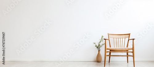A chair and vase in room © Ilgun