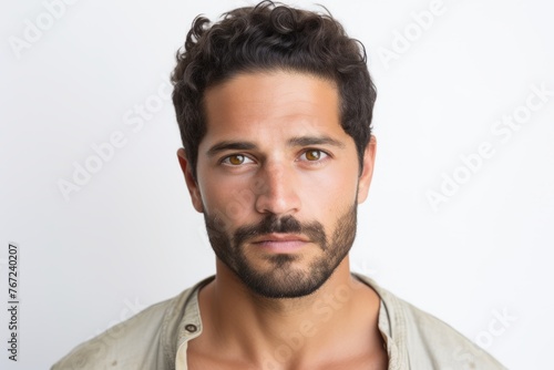 Portrait of a handsome young man with beard and mustache on white background