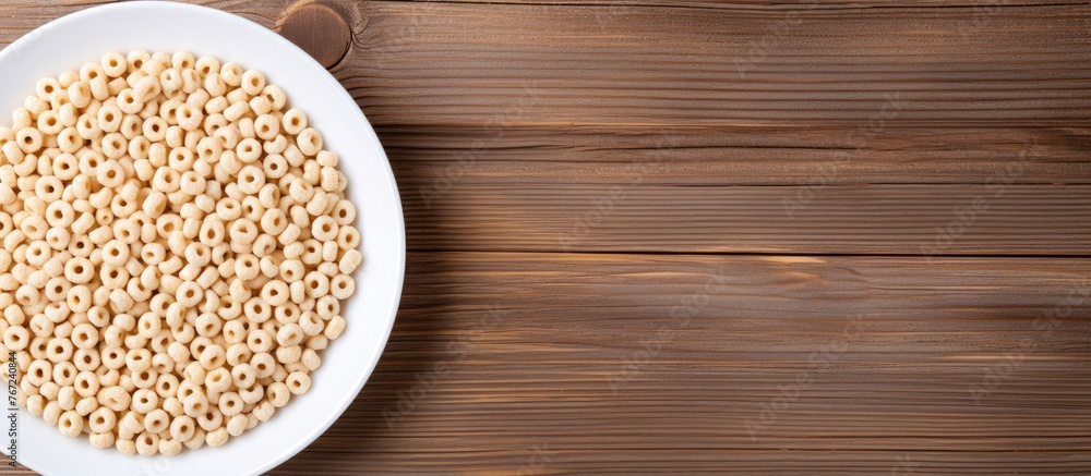 A plate with breakfast cereal on a wooden table A plate with breakfast cereal on a wooden table