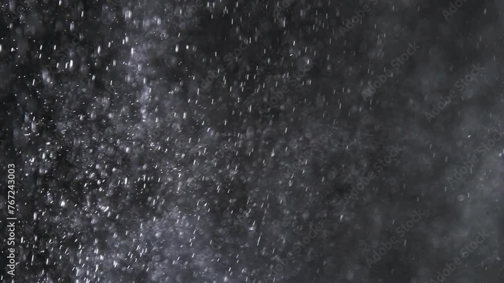small drops of rain, snow on a black background. wind. Natural background. slow motion small drops of rain, snow on a black background. wind. Natural background. slow motion