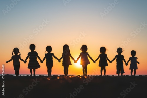 Silhouettes of children at dusk