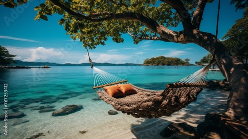 Tropical island getaway. relax in a hammock under a palm tree with stunning sea views