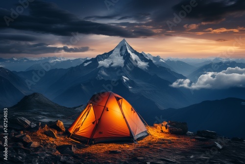 Tranquil mountain camping experience at the base of breathtaking snow-covered peaks