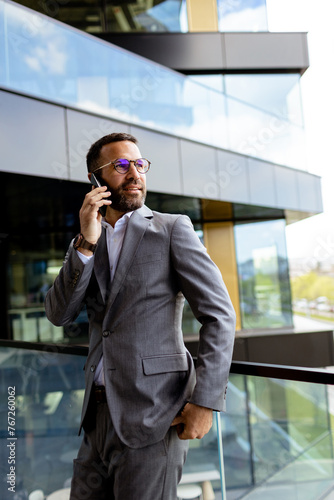 Confident Businessman Smili...