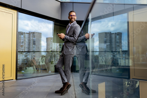 Confident Businessman Smili...