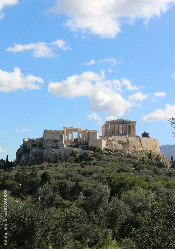 Summer Splendor: Acropolis Beneath Blue Skies and Fluffy Clouds