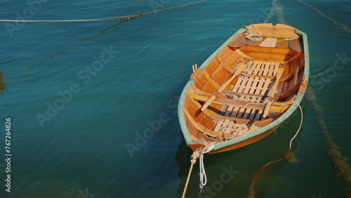 Photography A new wooden boat is moored offshore