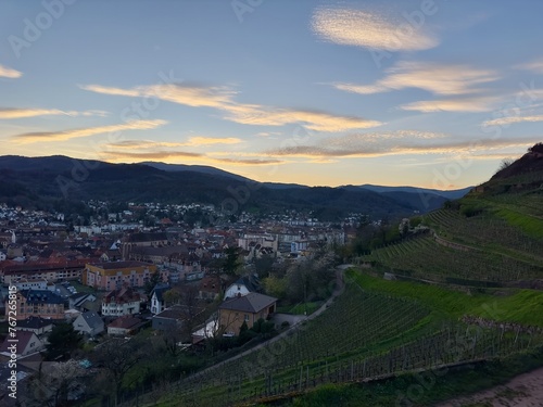 Dusk Embraces Guebwiller Amidst the Vosges Foothills with Verdant Vineyard Slopes