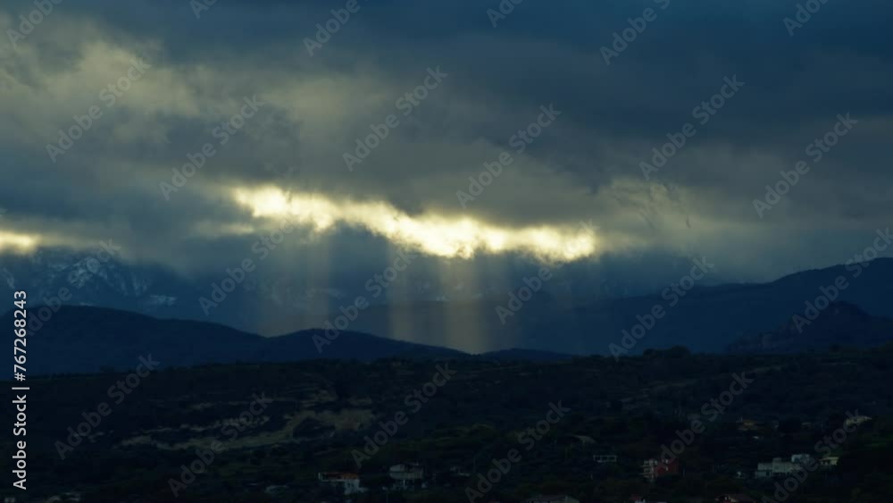Sun beams Passing Through The Clouds 