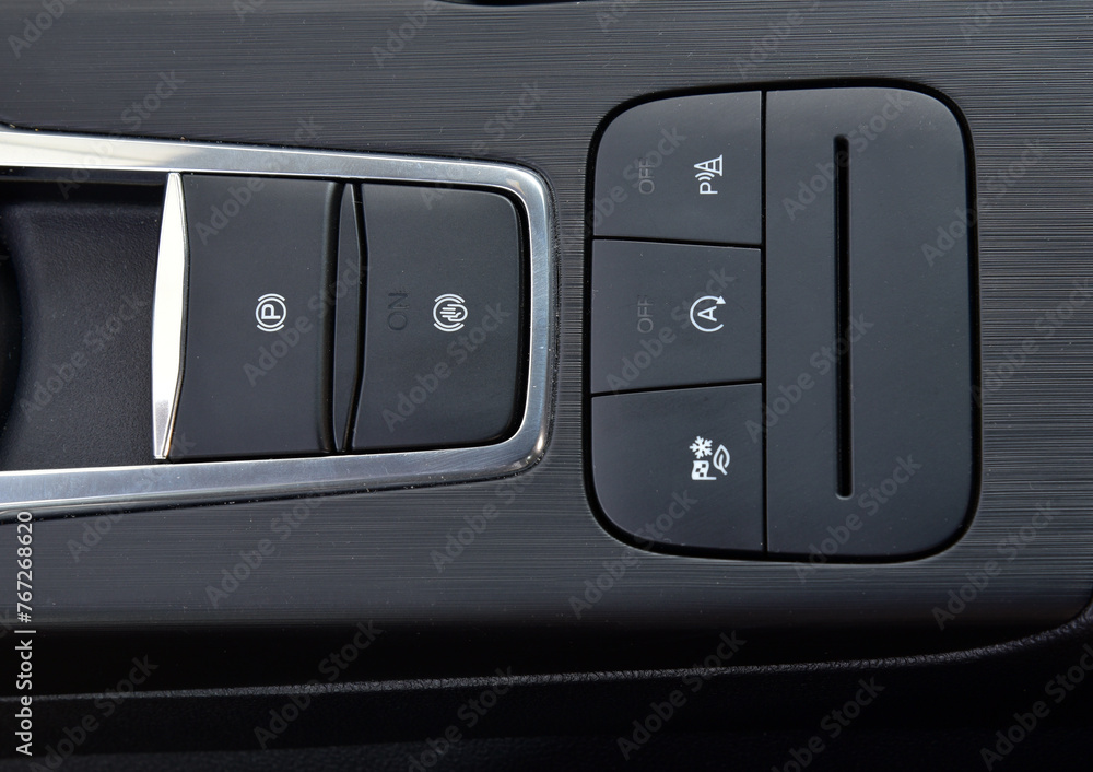 Close-up of black buttons on car panel Close-up of black buttons on car panel