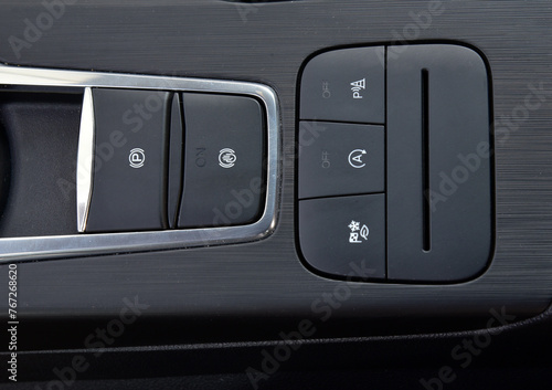 Close-up of black buttons on car panel