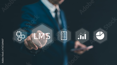 LMS, Learning management system concept. Man hand touching virtual screen to LMS - Learning Management System web icon for lesson and online education, course, application, study, e learning.