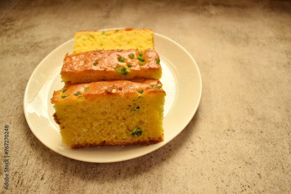 Closeup picture of a tasty fruit cake with colorful plum
