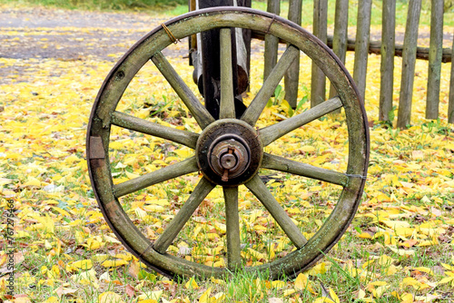 Antique wooden cart wheel in the village