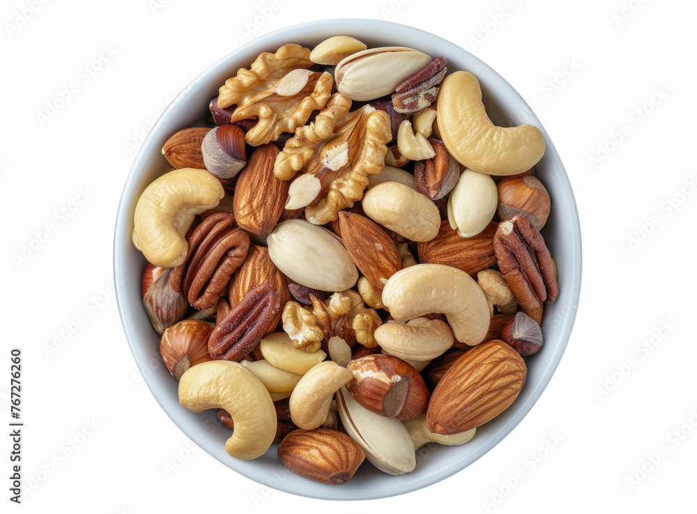 A top-down shot showcasing a bowl of mixed nuts arranged on a white table, offering a delightful assortment of walnuts, pistachios, almonds, hazelnuts, and cashews as a healthy snack choice A top-down shot showcasing a bowl of mixed nuts arranged on a white table, offering a delightful assortment of walnuts, pistachios, almonds, hazelnuts, and cashews as a healthy snack choice