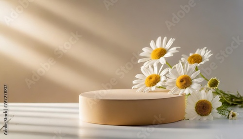 empty cylindrical podium or pedestal with chamomile flowers on a white background blank shelf product standing background