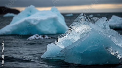 Thawing icebergs with drops of water falling into the sea photo