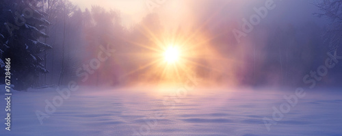The sun peeking through dense fog over a snow-covered meadow, creating a mystical atmosphere