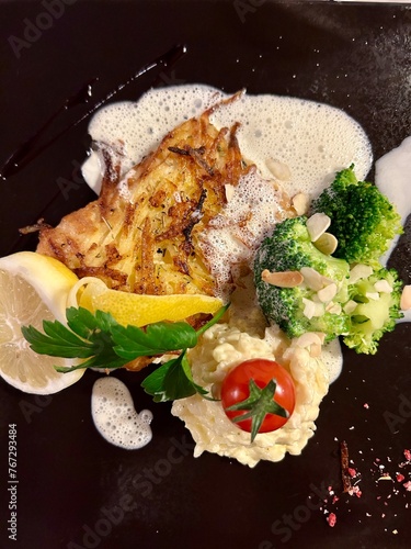 Salmon with mashed potatoes and broccoli