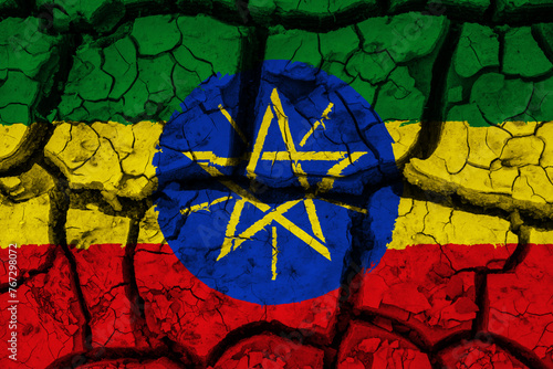 Obraz na płótnie Dry soil pattern on the flag of Ethiopia. Country with drought concept due to climate change. Water problem. Dry cracked earth country. w salonie