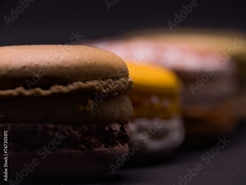 Typical French pastry - Set of macaroons on black background