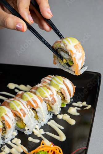 sushi on a plate with chopstick photo