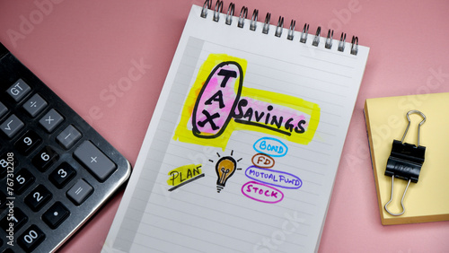 Concept of tax planning written on note pad while doing filing or future.