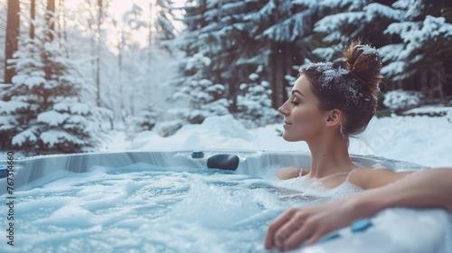 luxurious winter spa day for a young woman, soaking in an outdoor hot tub jacuzzi and appreciating the snowy forest scenery at a relaxing resort