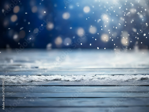 Old snow-covered wooden table and falling snowflakes. Winter background.