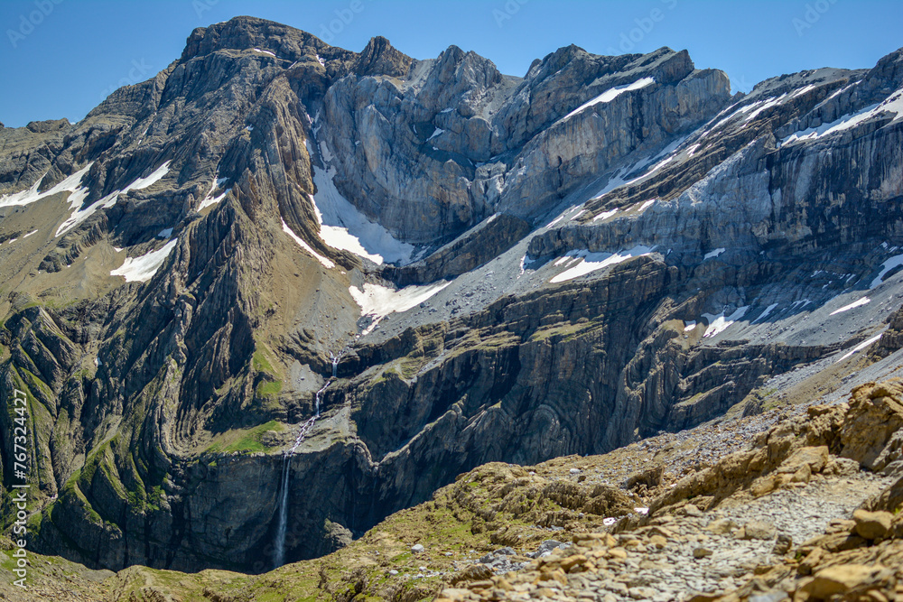 Cirque De Gavarnie, a beautiful waterfall and glacier in the French Pyrenees in summer with snow