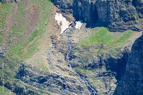 Cirque De Gavarnie, a beautiful waterfall in the French Pyrenees in summer with snow