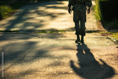 An abstract image of a soldier walking up the driveway to their home, their shadow stretching out behind them.