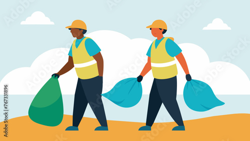 Two employees can be seen carrying bags of trash as they participate in a beach cleanup event with other volunteers. They are wearing company