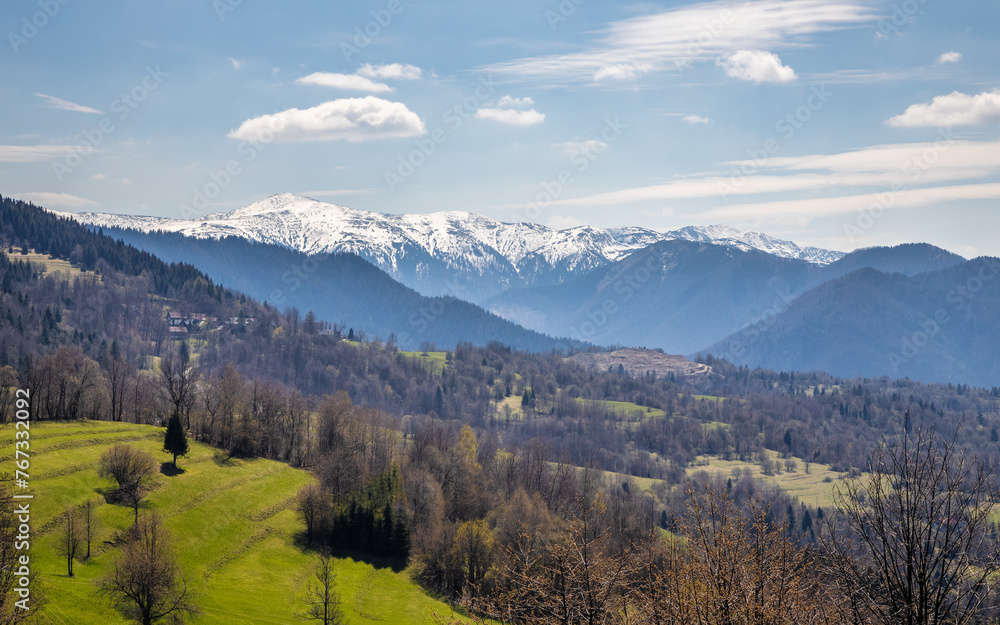 Spring landscape with snowy mountains in the background. View of The Mala Fatra national park in Slovakia, Europe.