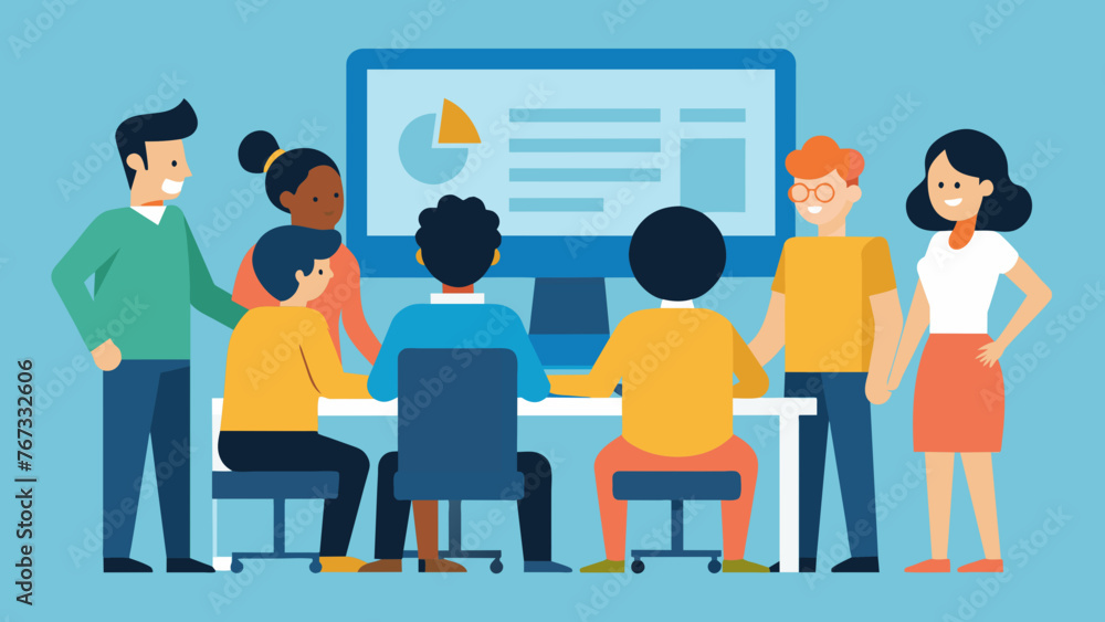 A group of employees are gathered around a computer screen in a bright modern office. A trainer stands at the front of the room engaging the A group of employees are gathered around a computer screen in a bright modern office. A trainer stands at the front of the room engaging the