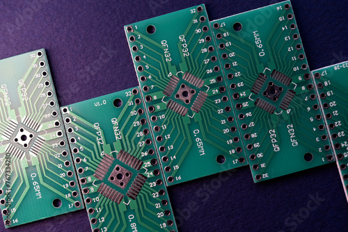 Green printed circuit boards for soldering radio components.  A set for a beginner amateur radio operator. photo