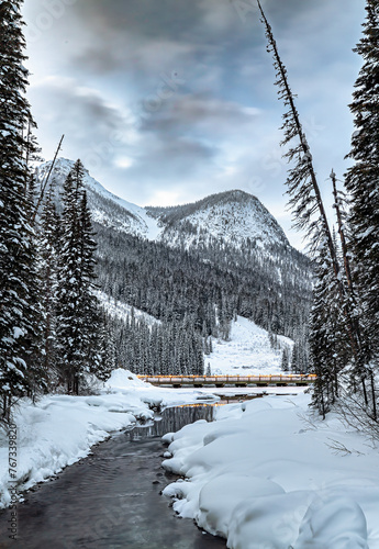 Lighted bridge over a Rocky Mountain Winter creek photo