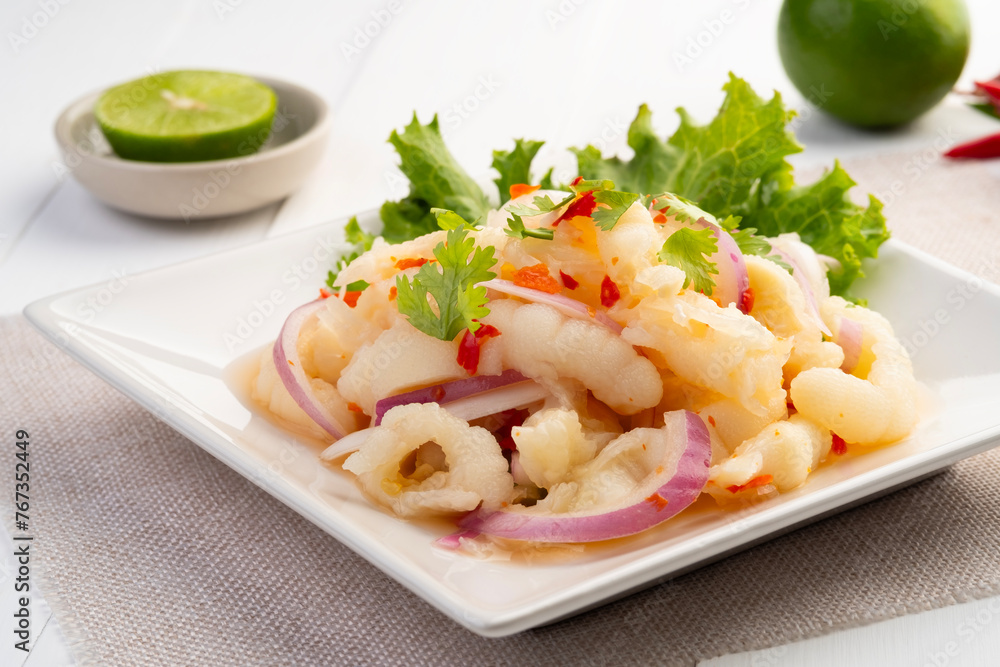 Spicy chicken paw,Thai Spicy Salad boiled Chicken Feet with chili sauce in white plate