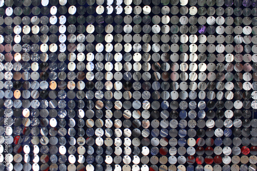 festive, shiny background in the form of rows of silver circles