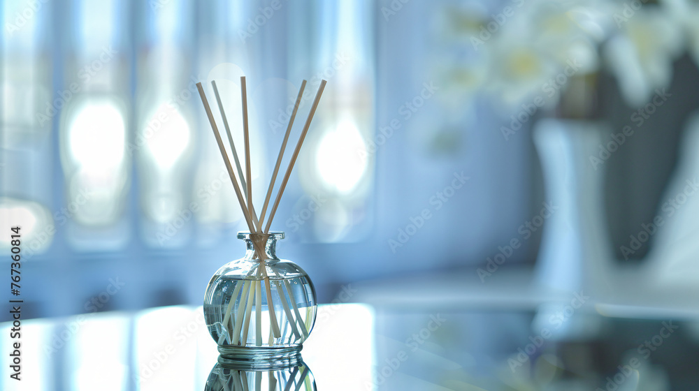 A luxurious scented diffuser with reed sticks on a reflective white surface. - obrazy, fototapety, plakaty 