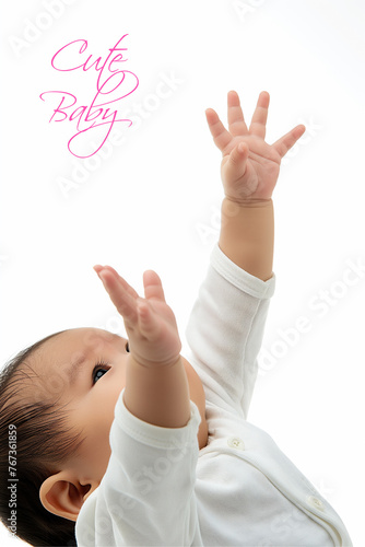 An Indian new born baby the baby's hand is holing in the air photo