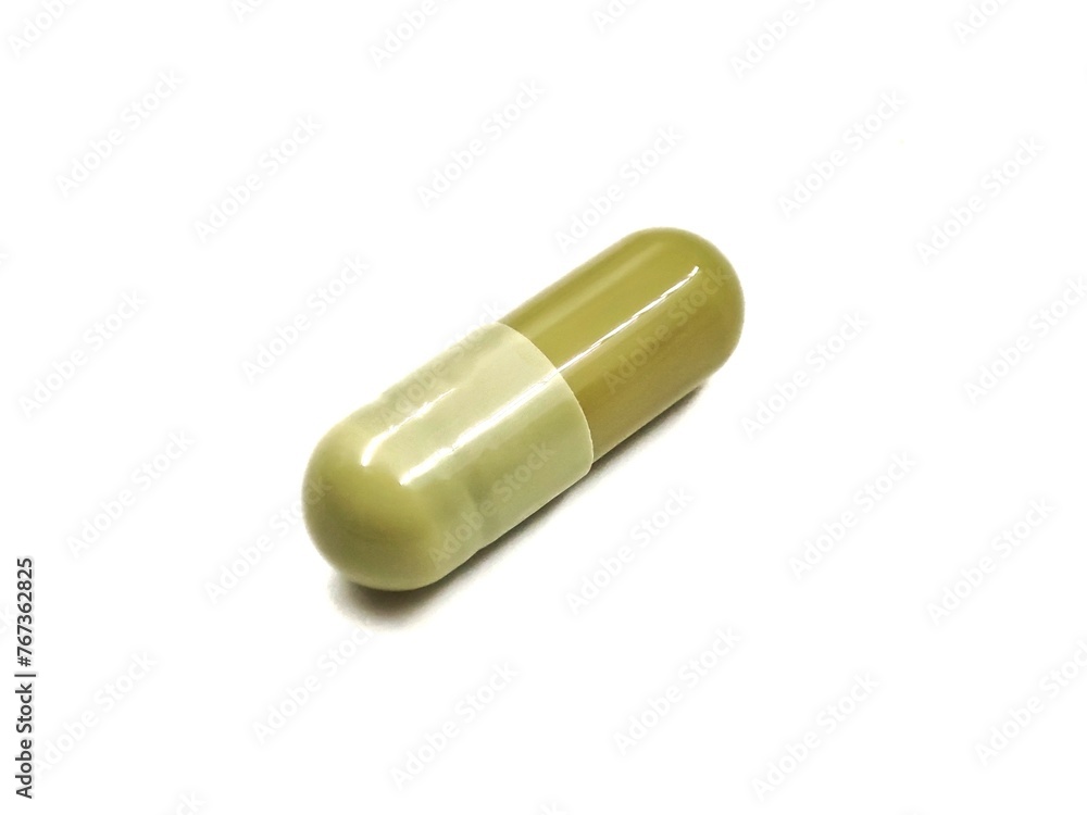 Top view of a pill, isolated on white background. Top view of a pill, isolated on white background.