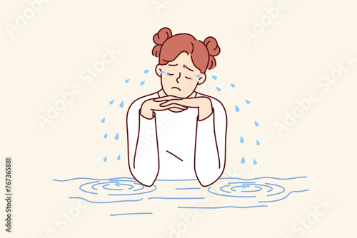 Teenage woman is crying sitting at table, experiencing stress and depression due to problems with classmates or school bullying. Girl crying after breaking up with boyfriend or quarrel with friend