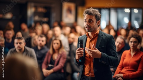Engaging Speaker at a Public Event. A charismatic speaker engages with an audience during a lively public speaking event. photo