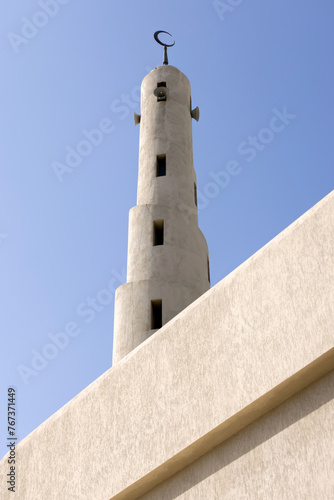 Minaret of the mosque against blue skies in Abu Dhabi, UAE