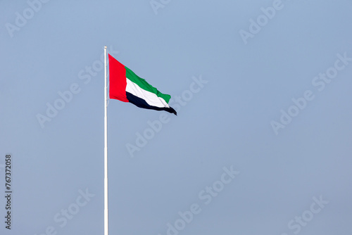 UAE flag waving in Abu Dhabi. UAE National day. UAE flag day.
