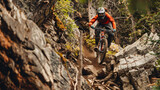 A mountain biker navigating a rock garden on a technical trail.